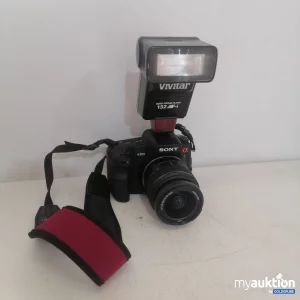 Auktion Sony Kamera mit Objektiv und Blitzgerät