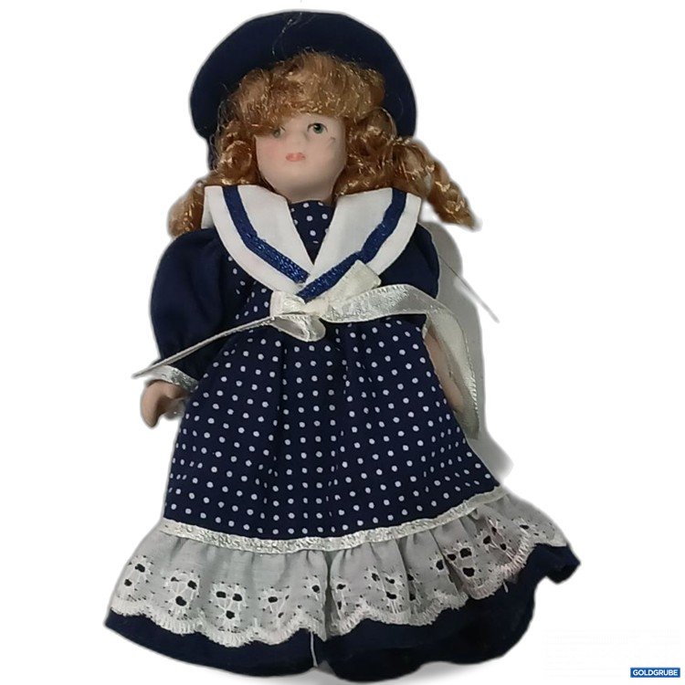 Artikel Nr. 961946: Porzellanpuppe mit blauer Kleidung
Ca 15cm groß